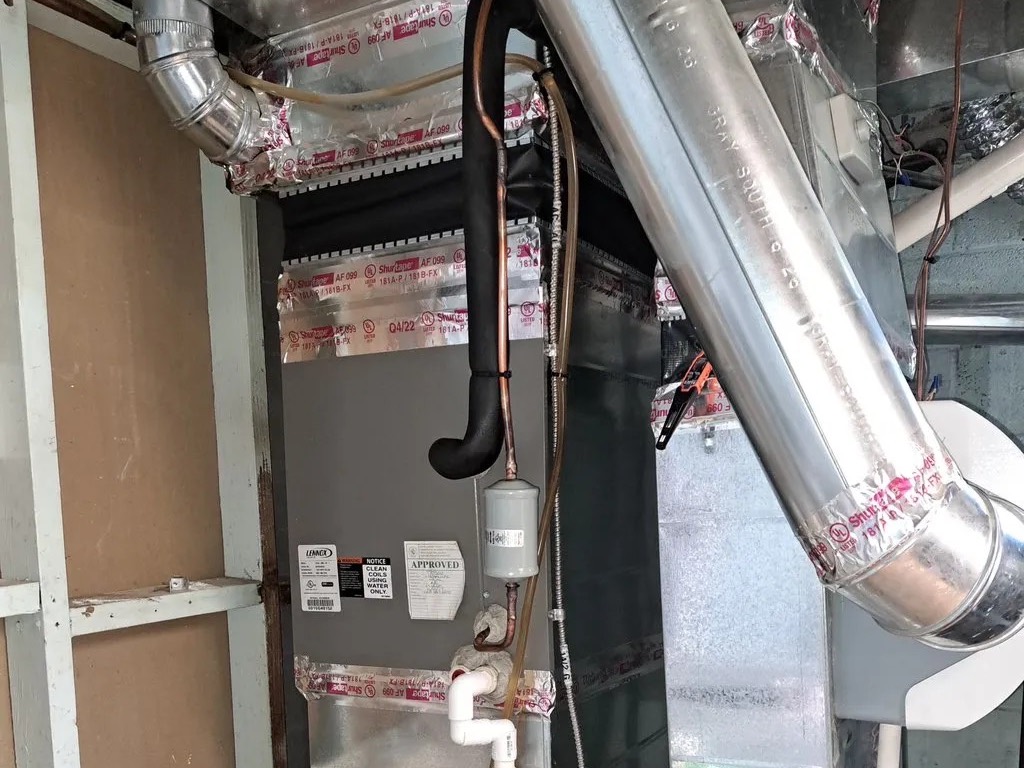 Indoor air handler with sheet metal ductwork during an installation