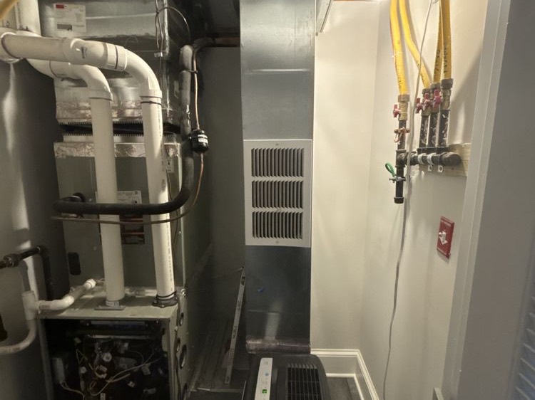 Gas furnace and venting in a utility closet
